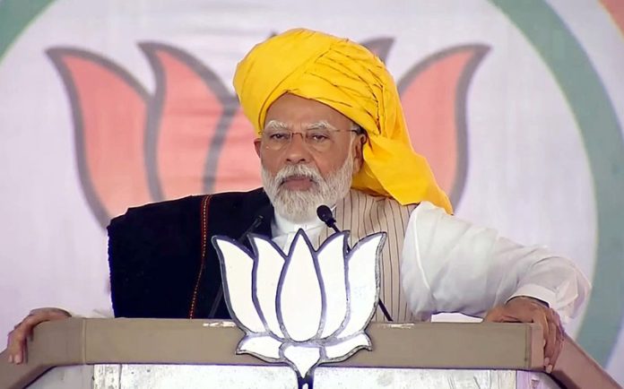 Prime Minister Narendra Modi addressing a public meeting for the Lok Sabha Elections-2024, in Madha, Maharashtra on Tuesday. (UNI)