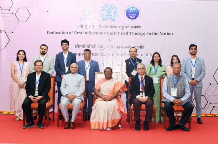 President Droupadi Murmu in a group photograph during the launch of the India's first home-grown gene therapy for cancer at IIT Bombay, in Maharashtra on Thursday. (UNI)