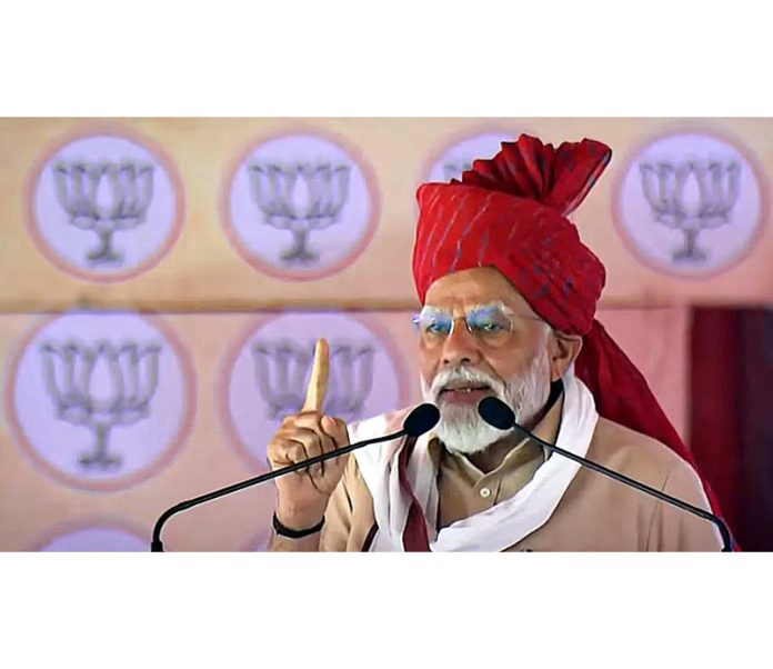 Prime Minister Narendra Modi addresses a public meeting ahead of Lok Sabha elections, in Churu, Rajasthan on Friday.