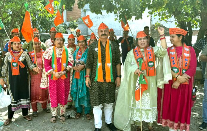 BJP vice president, Yudhvir Sethi during door to door campaign in Purani Mandi on Saturday.