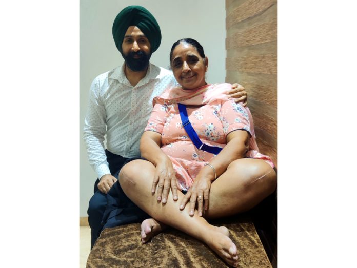 Dr Ranjit Singh posing with patient Kuldeep Kaur, after performing at IVY Hospital in Amritsar on Saturday.