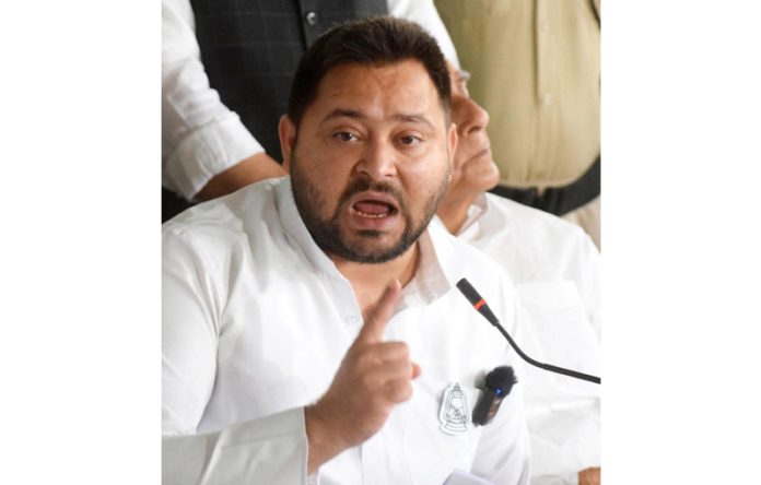 Bihar Opposition leader Tejashwi Yadav addressing a press conference at party office, in Patna on Saturday. (UNI)