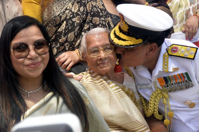 Admiral Dinesh K Tripathi the new Chief of Naval Staff kissing his mother after assuming charge of office at South Block lawn, in New Delhi on Tuesday. (UNI)