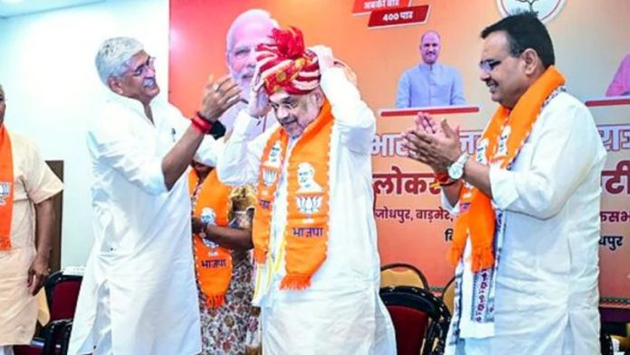 Home Minister Amit Shah being welcomed by Union Minister Gajendra Singh Shekhawat and Rajasthan Chief Minister Bhajan Lal Sharma, at a BJP meeting, in Jodhpur on Monday.