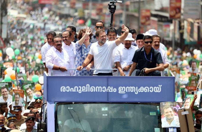 Congress candidate Rahul Gandhi with party leaders Priyanka Gandhi and KC Venugopal at a road show before filing his nomination papers for the upcoming Lok Sabha elections, in Wayanad on Wednesday. (UNI)