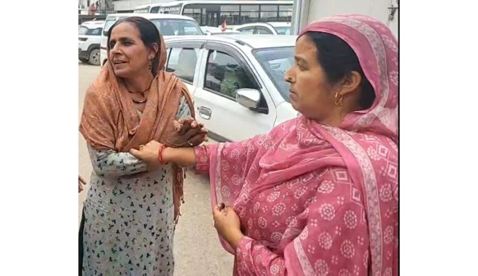 Shocked mother looks helpless as Army vehicle crushed her son in Rajouri. -Excelsior/Imran