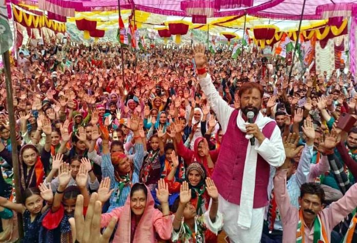 Ex-MP and Cong candidate Ch Lal Singh addressing large public rally at Dhar-Mahanpur in Kathua on Tuesday.