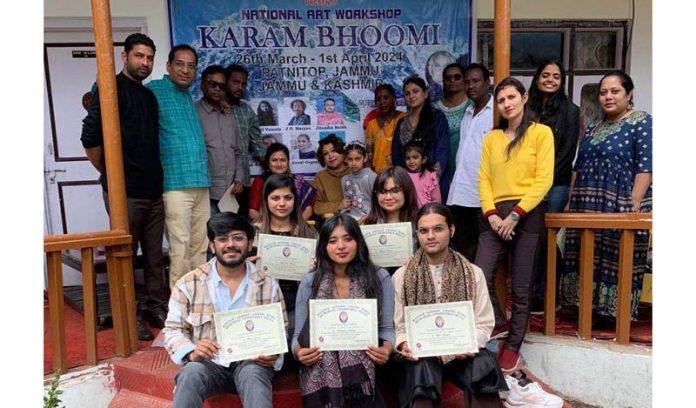 Students, who participated in an art workshop organised by MSCBMT, posing with their certificates on Sunday.