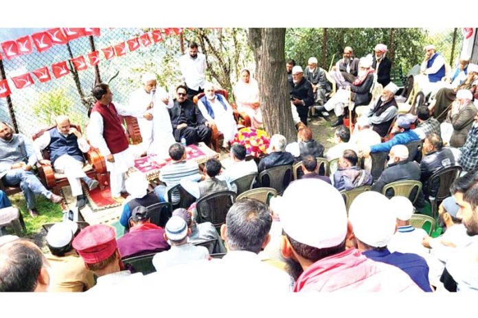 Former Minister and additional general secretary of National Conference Ajay Kumar Sadhotra addressing a public meeting at Sarh Bagga in Mahore Constituency.