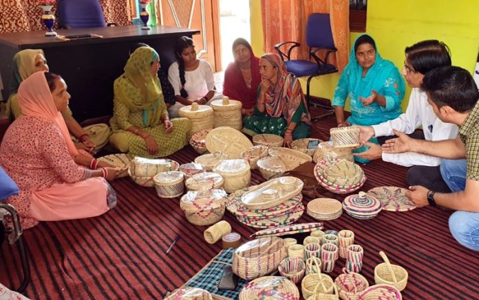 KVK,Reasi scientist observing the local hand made handicrafts at Kheral village In Reasi distt.