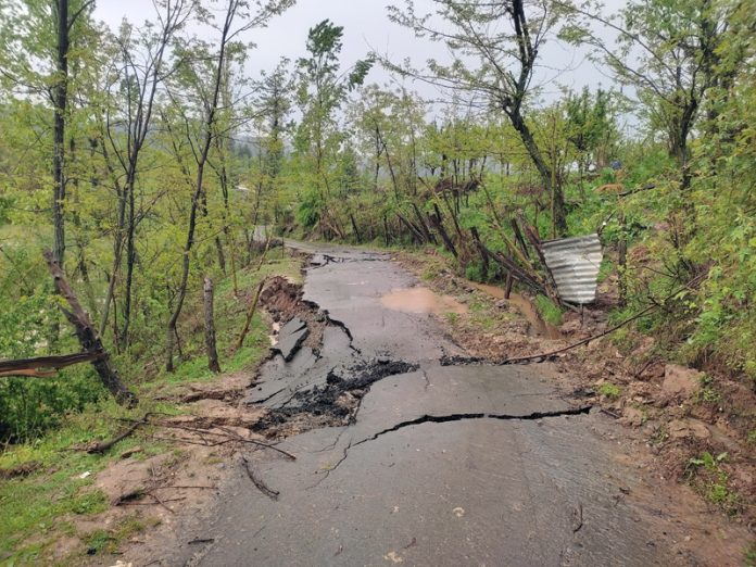 View of damaged Pakhwara-Tangmulla link road in Rafiabad area of Baramulla district. — Excelsior / Aabid Nabi