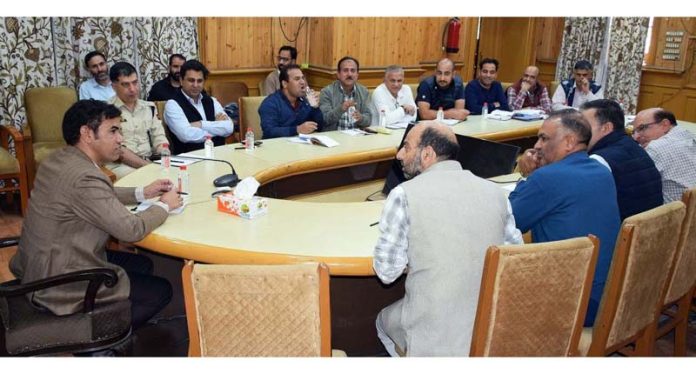 Div Com Kashmir Vijay Kumar Bidhuri chairing a meeting on Thursday.