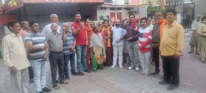 BJP leader, Bali Bhagat along with others posing for a group photograph after a public meeting at Jammu on Tuesday.