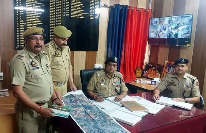 DIG JSK Range inspecting record register at Police Station Domana in Jammu District on Friday.