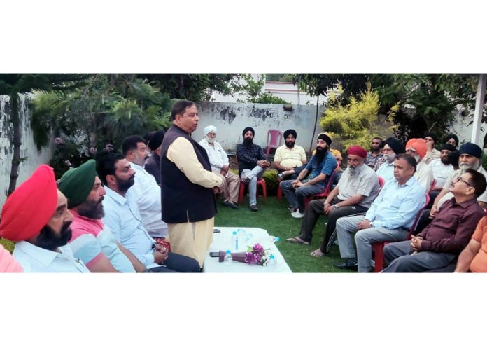Senior BJP leader and former Minister Sat Sharma addressing a meeting at Gole Gujral on Saturday.