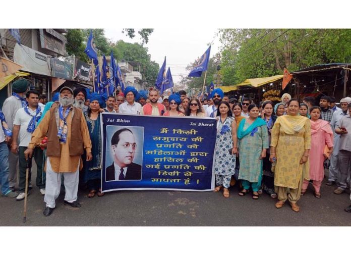 People during a rally taken out in RS Pura town on the occasion of birth anniversary of Dr BR Ambedkar.
