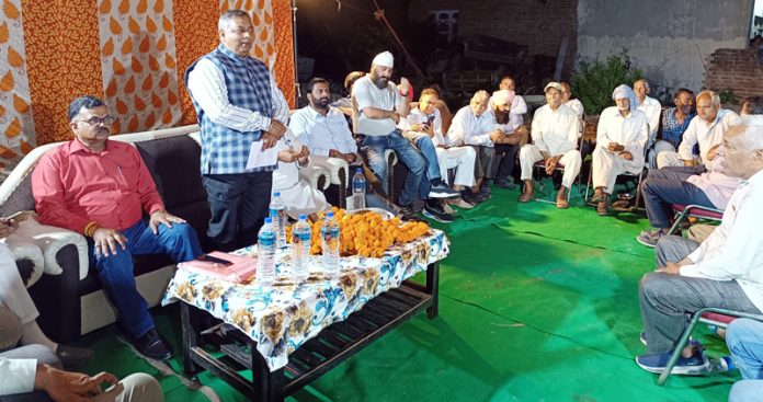 Senior BJP leader and former Minister Sat Sharma addressing a public meeting at Talab Tillo on Wednesday.