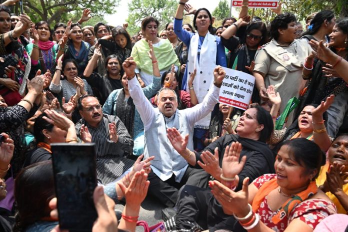 BJP national general secretary Tarun Chugh at party Mahila Morchas protest in front of Congress office at Chandigarh.