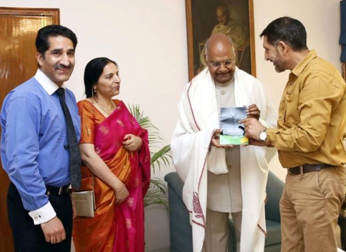Kuldeep Kashmiri presenting his book to Ram Nath Kovind former President of India at Raj Bhavan Chandigarh on Friday.