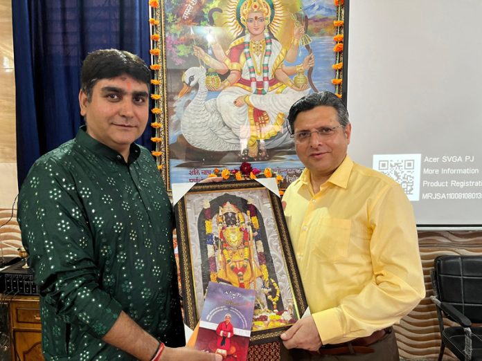 Relief and Rehabilitation Commissioner, Dr Arvind Karwani being presented an award of honour by Kanwal Peshin renowned artist and poet on behalf of Athrot Foundation at Jammu on Sunday.