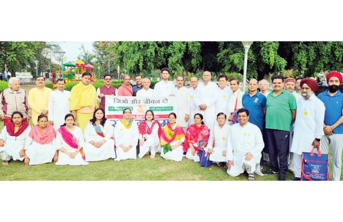 K B Jandial along with sadhaks during a yoga camp organised by Bharatiya Yog Sansthan in Jammu on Friday.