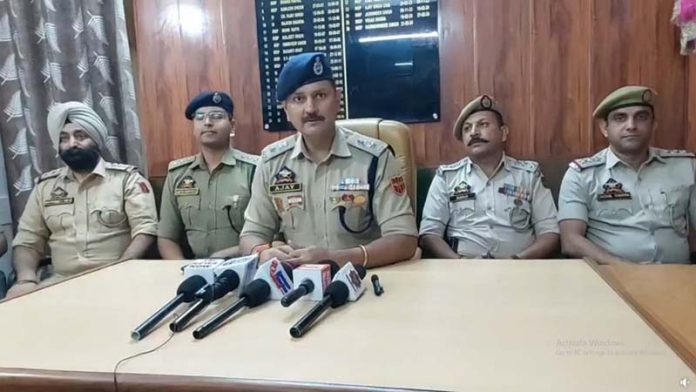 SP Jammu South Zone Ajay Sharma, accompanied by SHOs of the Zone, addressing a press conference on Friday.