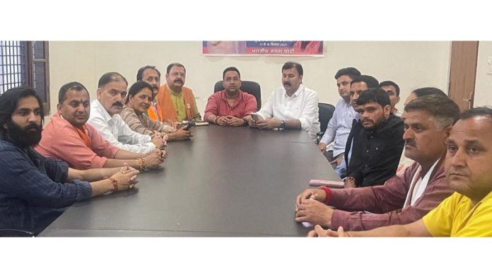 BJP leaders during a meeting in Reasi on Monday.