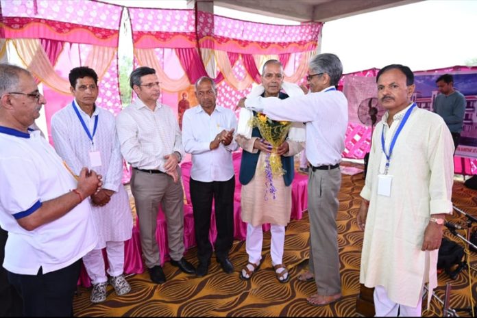 A religious scholar being honoured at a Symposium on Kashmir Shaivism organised at Panjgrain, Nagrota.