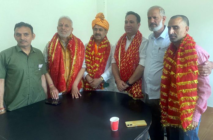 BJP leaders Sunil Sharma, Ved Sharma alongwith local party workers during their visit to Reasi on Wednesday.