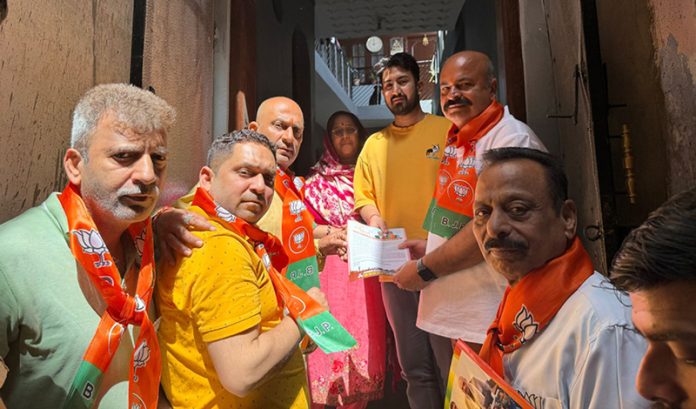 BJP vice president, Yudhvir Sethi accompanied by party activists during a campaign in Jammu on Sunday.