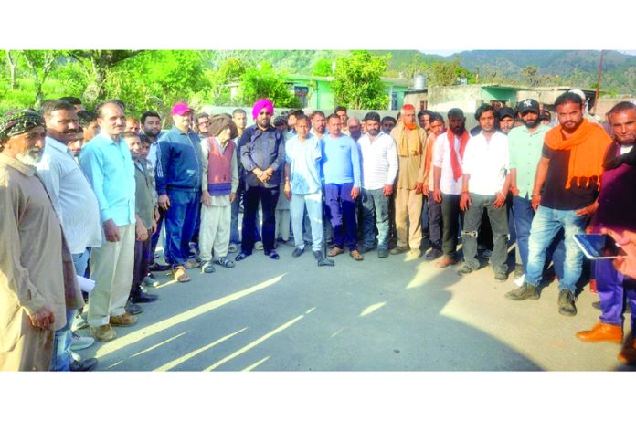Congress leader, Taranjit Singh Tony along with others posing for a group photograph after a public meeting in Udhampur on Sunday.