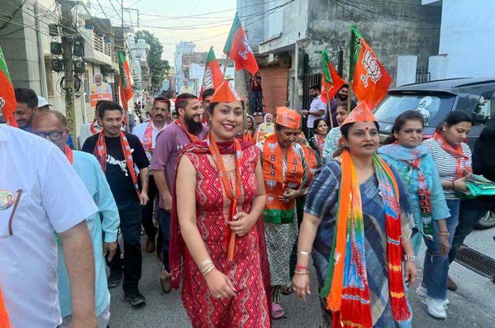 Senior BJP leader and former Minister, Priya Sethi during door to door campaign in Jammu on Monday.