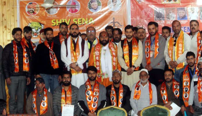 New entrants posing for a group photograph with Shiv Sena leaders in Budgam on Sunday.