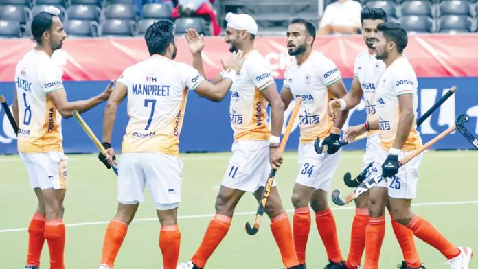 Indian Hockey team celebrating after defeating Argentina by 5-4 at Belgium.