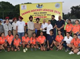 Transport Commissioner Rajender Singh Tara along with other dignitaries presenting winner's trophy to Hockey team in Jammu.