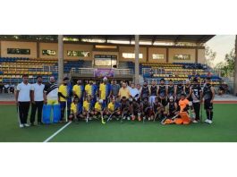 Players of winning team posing with guests and match officials at KK Hakku Stadium, Jammu.