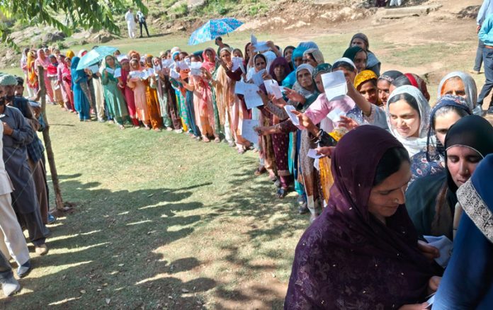 Long queue of female voters waiting for their turn in front of a Polling Station in Rajouri. -Excelsior/Imran