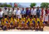 Players posing along with dignitaries during an inter school zonal level competition at Pouni.