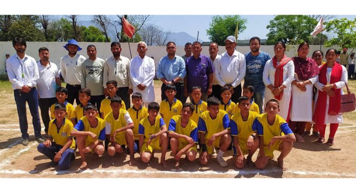 Players posing along with dignitaries during an inter school zonal level competition at Pouni.