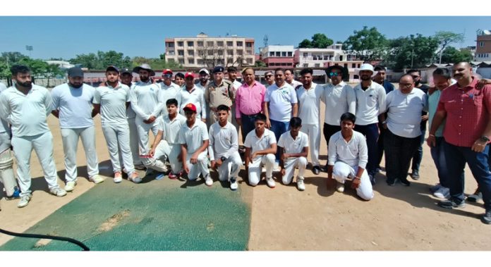 SSP, Jammu Dr Vinod Kumar posing along with players and Members of Press Club Jammu during inaugural event of Ashok Sodhi Memorial T-20 Cricket Tournament at Jammu. -Excelsior/Rakesh