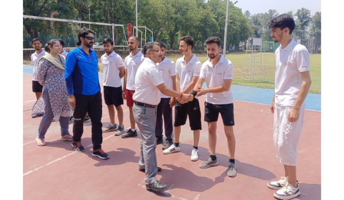 Prof Yashpal Sharma (Rector of Udhampur Campus, JU) interacting with players before an Inter-Departmental Volleyball match.