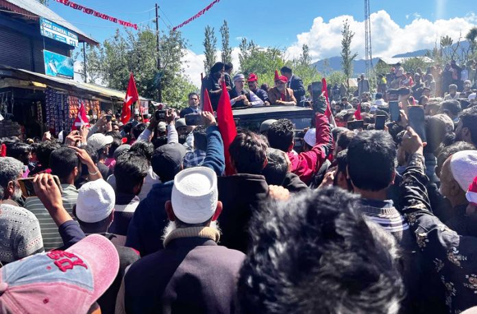NC candidate for Baramulla parliamentary constituency Omar Abdullah surrounded by people during a road show in Baramulla district.