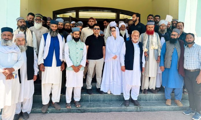 Chairperson of J&K Waqf Board Dr Syed Darakhshan Andrabi posing with Imams of Rajouri.