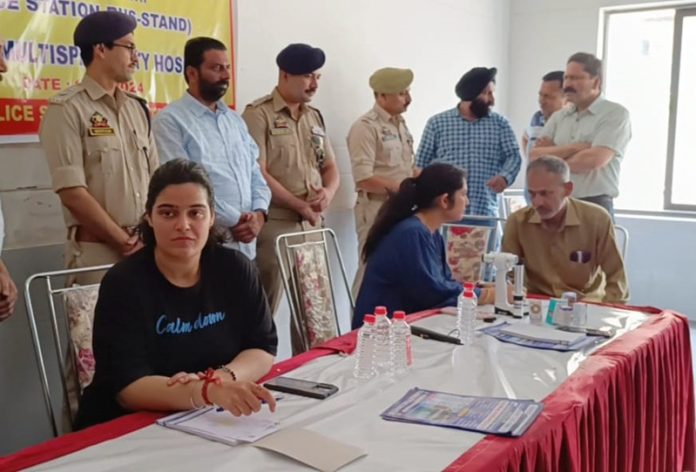 A doctor examining a patient at a health check-up camp in Jammu on Saturday.