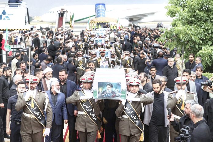 Iran's supreme leader presides over funeral  for President and others killed in helicopter crash