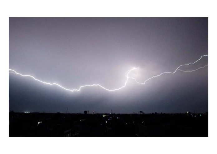 Lightning strikes over Jammu amidst rain on Friday. -Excelsior/Rakesh
