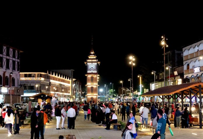 Bustling scenes near the historic Ghanta Ghar, with its illuminated surroundings attracting both locals and tourists on Friday evening. The spot has become favorite for people to spend time especially after the Sunset. -Excelsior/Shakeel