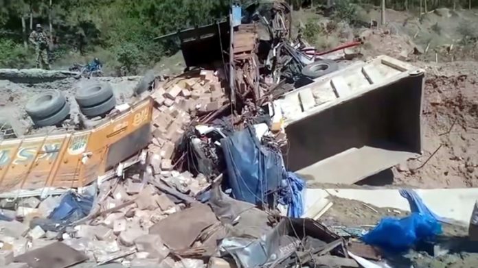 Wreckage of a truck and a dumper which met with an accident at Dalwas, Ramban.