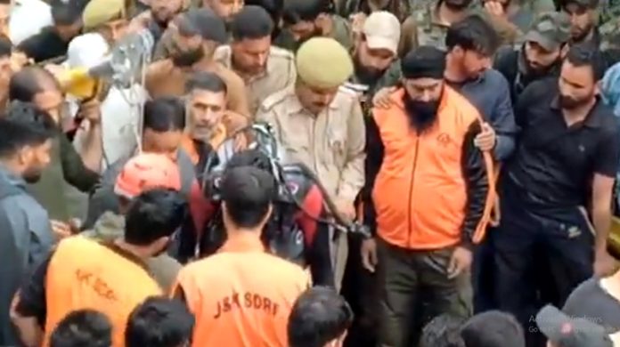 SDRF & police personnel during rescue operation near the Well in Budgam on Wednesday.