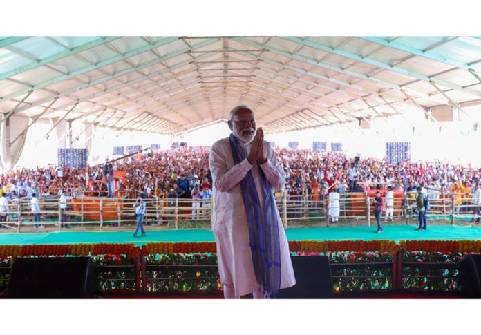 Prime Minister Narendra Modi at a public meeting for Lok Sabha elections in Dumka district, Jharkhand on Tuesday. (UNI)